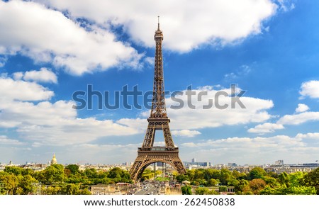 Paris skyline background, France. Landscape of Paris, view of majestic Eiffel Tower. It is top tourist attraction of Paris. Scenic panorama of city, sky and famous old Parisian landmark in summer. 