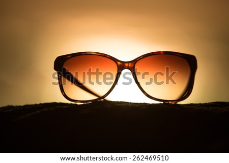 Sunglasses at Sunset Overlooking Beach