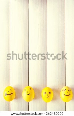 Easter eggs. Funny eggs on a light board. Easter 2015. Eggs smilies. Happy easter. Toning in a warm color.