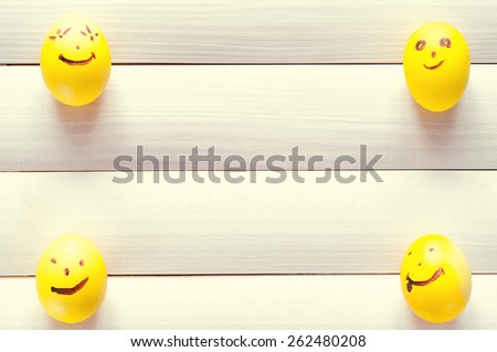 Easter eggs. Funny eggs on a light board. Easter 2015. Eggs smilies. Happy easter. Toning in a warm color.