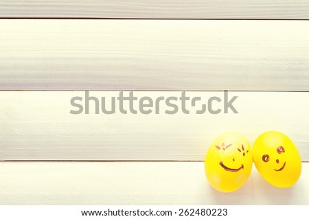 Easter eggs. Funny eggs on a light board. Easter 2016. Eggs smilies. Happy Easter. Toning in a warm color.