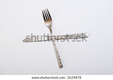  Knife and fork isolated against white