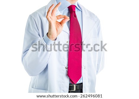 Caucasian male doctor dressed in white coat, blue shirt and red tie is making little bit gesture