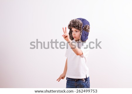 Young boy in a gesture of success