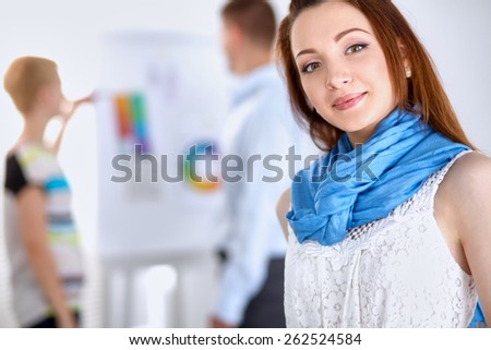 Portrait of attractive female  designer in office