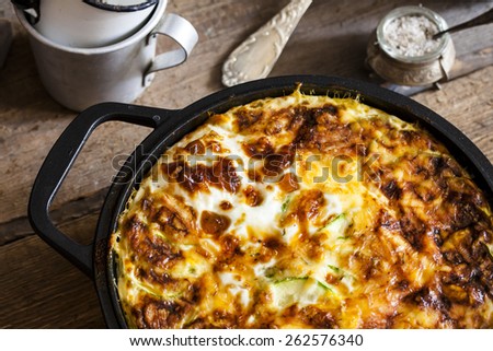 casserole of rice, vegetables, cheese and zucchini Royalty-Free Stock Photo #262576340