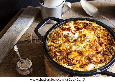 casserole of rice, vegetables, cheese and zucchini Royalty-Free Stock Photo #262576343
