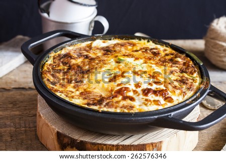 casserole of rice, vegetables, cheese and zucchini Royalty-Free Stock Photo #262576346