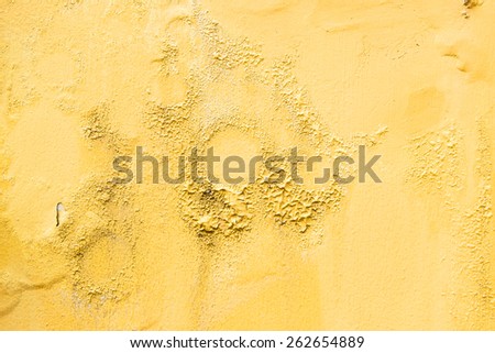 yellow erode painted concrete wall,grunge rough texture background