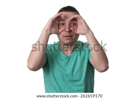 Man Using Hands Like Glasses - Isolated On White Background