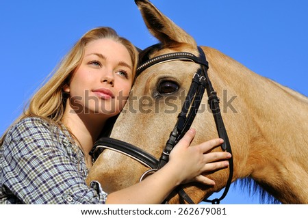 portrait of teenage girl and horse in summer day