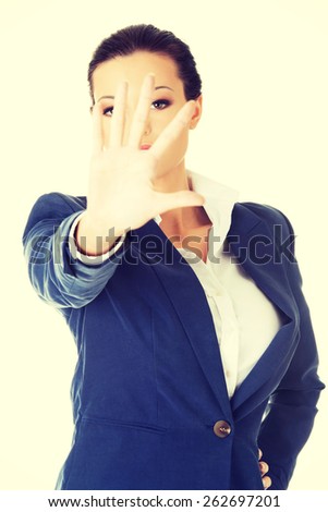 Businesswoman show NO gesture with confident expression.