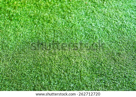 Green plastic grass texture.