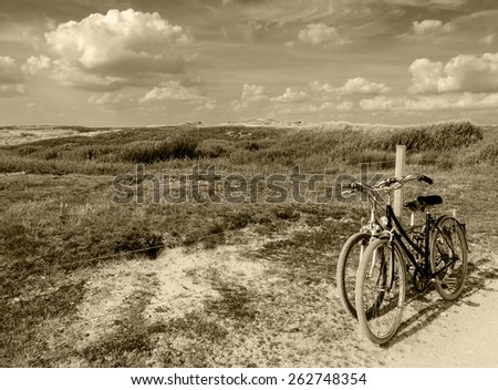 Two bicycles in countryside. Brittany, France. The concept of romance, love and simple everyday life. Aged photo. Sepia.