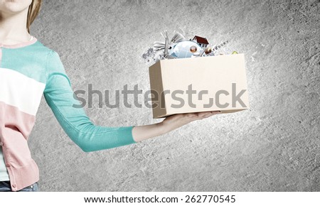 Close up of woman hand holding carton box