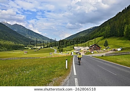 Austrian Alps-cyclists on the road in Rodarm