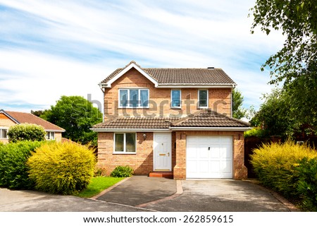 New detached house with garage Royalty-Free Stock Photo #262859615