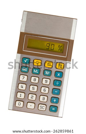 Old calculator with digital display showing a percentage - 90 percent