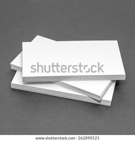 Business card template mockup for branding identity or contact information drawing with blank modern devices. Ready to print modern abstract design or hipster logo. Isolated on gray paper background.