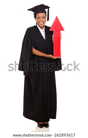 happy african female graduate holding red arrow isolated on white