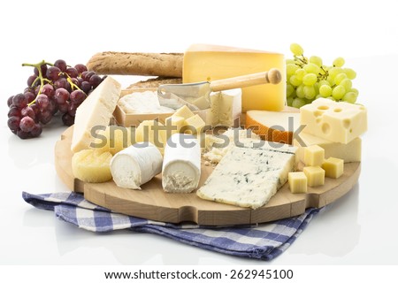 Cheese platter with different cheese and grapes Royalty-Free Stock Photo #262945100