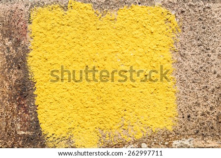 Creative beautiful brown background cracks and scratches on the concrete square of yellow paint, with space for text or image. Grungy concrete surface. Great background or texture for your project.