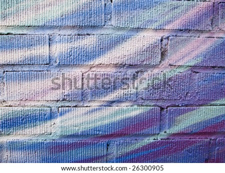 Airy pastel color background on brick wall