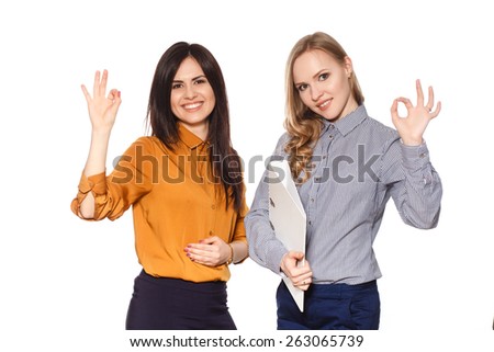 two business girls with folders isolated on a white background