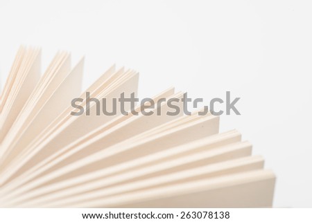 Open book pages in white background, close-up. Open book.