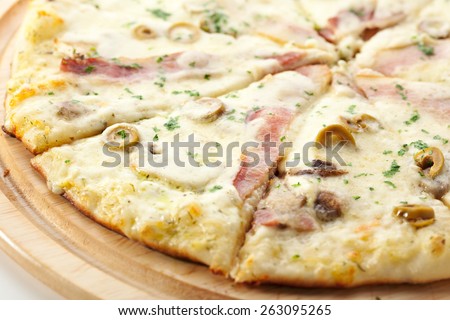 White Pizza made from Sour Cream Sauce, Mushrooms, Ham and Mozzarella Cheese