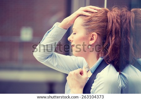 portrait stressed sad young woman outdoors. City urban life style stress  Royalty-Free Stock Photo #263104373