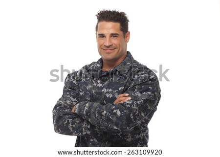 Veteran soldier army navy man posing with arms crossed against white background