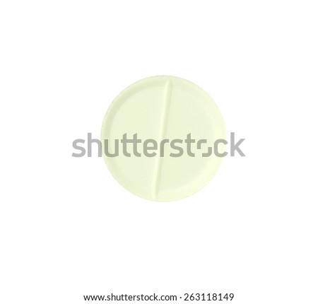 Macro yellow medical pill tablet isolated on white