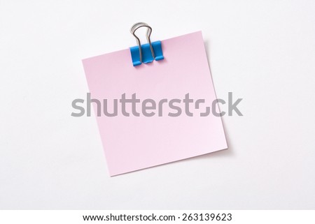 note paper and clip isolated on white background