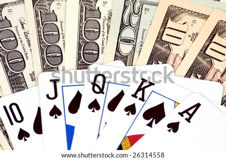 Gambling - American dollars and poker cards. Photo of different banknotes, money in different shapes and colors. Useful for financial, economic backgrounds.