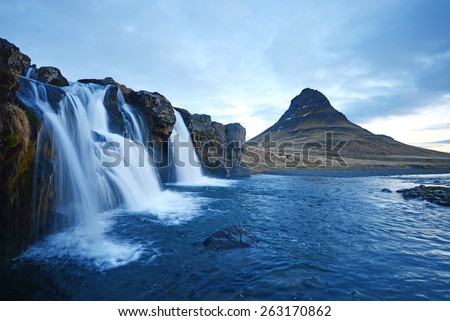 Kirkjufell mountain with waterfall cascades in iceland Royalty-Free Stock Photo #263170862