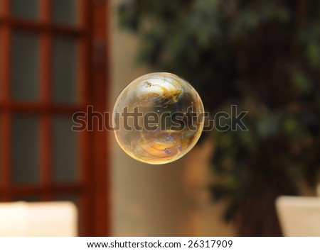 Soap bubble with room on background