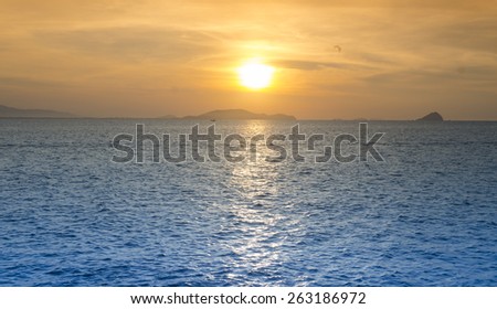 Bright sunrise under the sea surface with yellow red gradient colors
