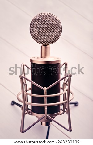 Big Condenser Microphone on Wooden Table