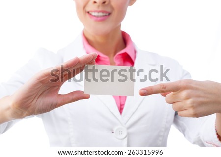 Business card closeup - businesswoman in white suit holding blank empty sign.