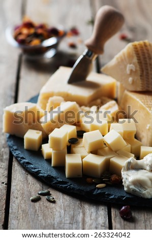 Various types of cheese on the table, selective focus