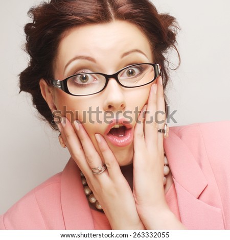 Young businesswoman in pink wearing glasses. Funny pictures.