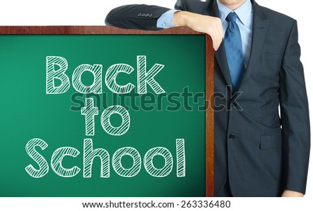 Back to school on blackboard presenting by businessman or teacher