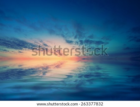 Dawn over the calm Black sea and small waves. Romantic mood transmitted color palette pictures
