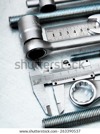 Metal working tools. Metal style. Metal tools on the scratched metal background.
