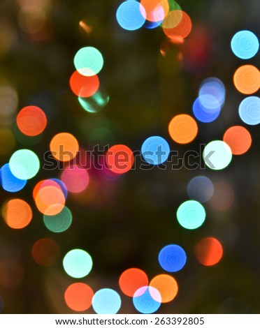 Abstract background bokeh. View Christmas tree lights photographed defocused lens, colorful bokeh.