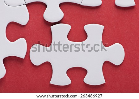 Puzzle over red background