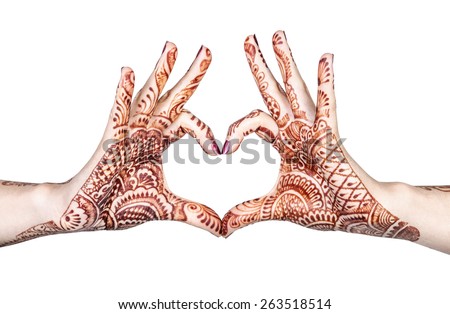 Woman hands with henna doing heart gesture isolated on white background with clipping path 