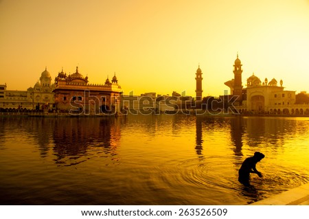 Sunset at Golden Temple in Amritsar, Punjab, India. Royalty-Free Stock Photo #263526509
