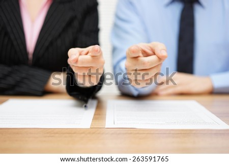 businessman and businesswoman pointing with fingers to you. Staffing and recruitment concept Royalty-Free Stock Photo #263591765